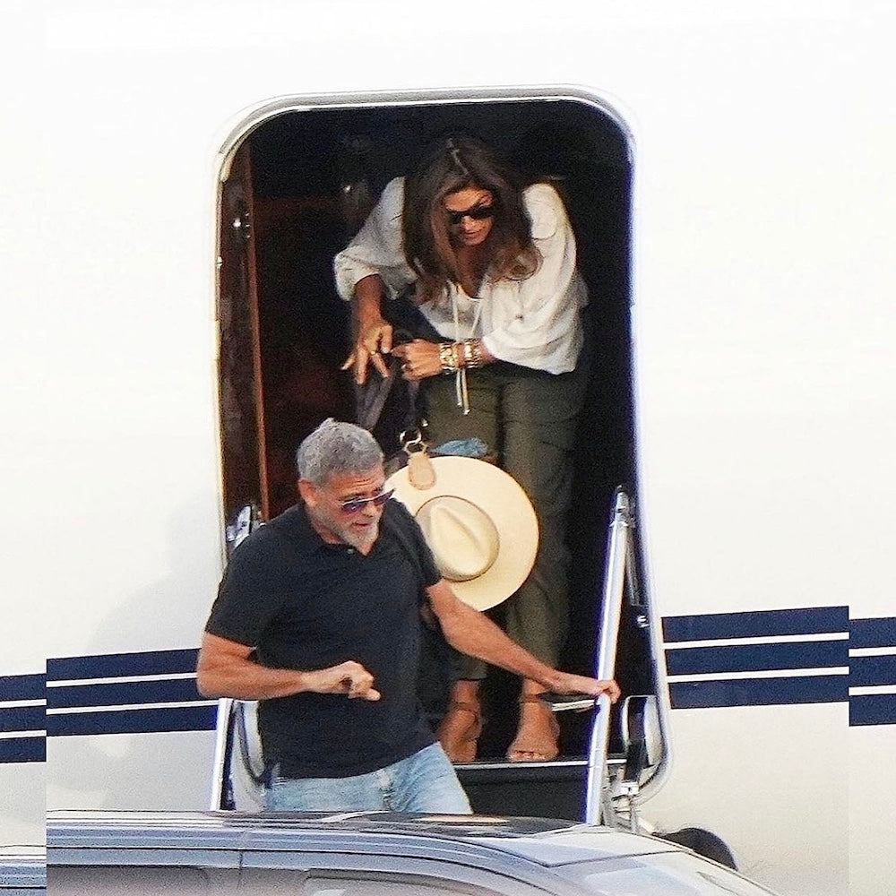 Cindy Crawford deplaning a private jet in France, showcasing the TOPTOTE hat clip, blending glamor with practicality