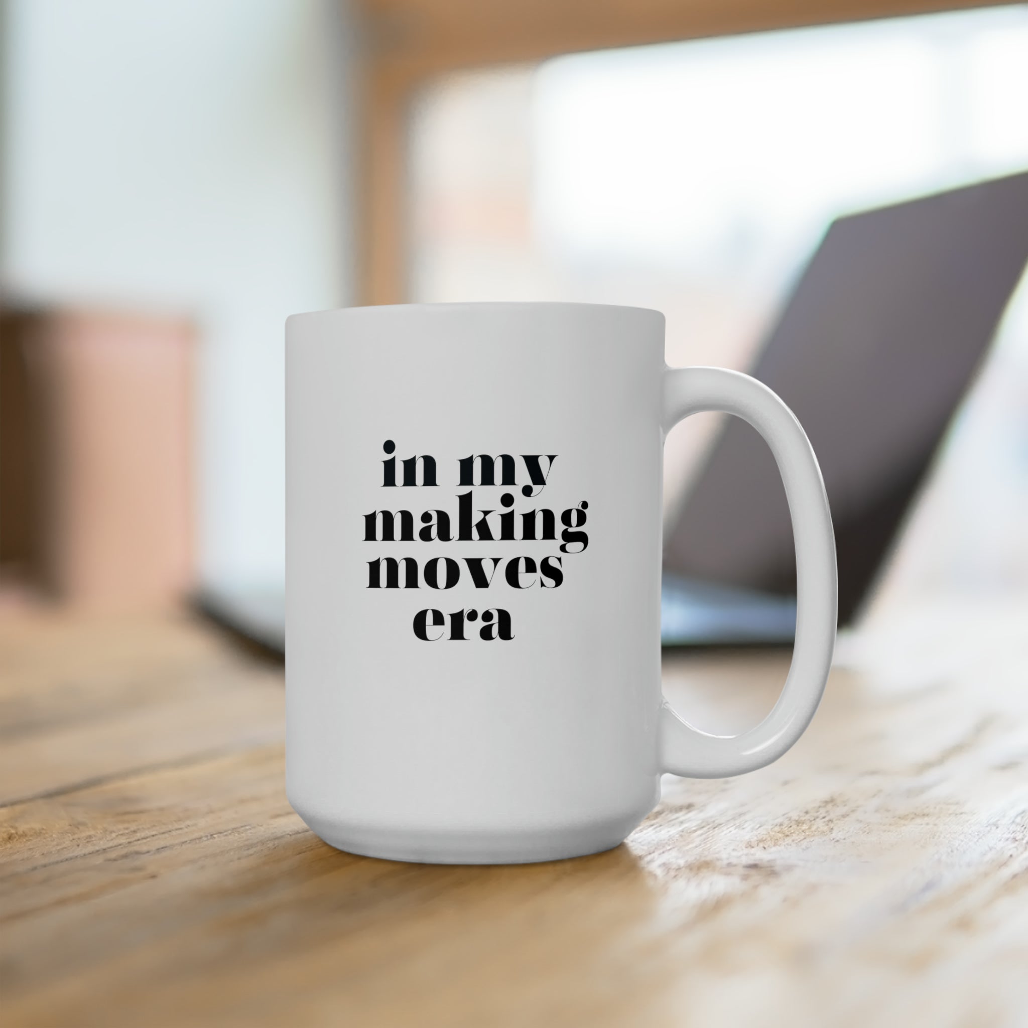Inspirational "In My Making Moves Era" 15oz white mug on wooden table with blurred background