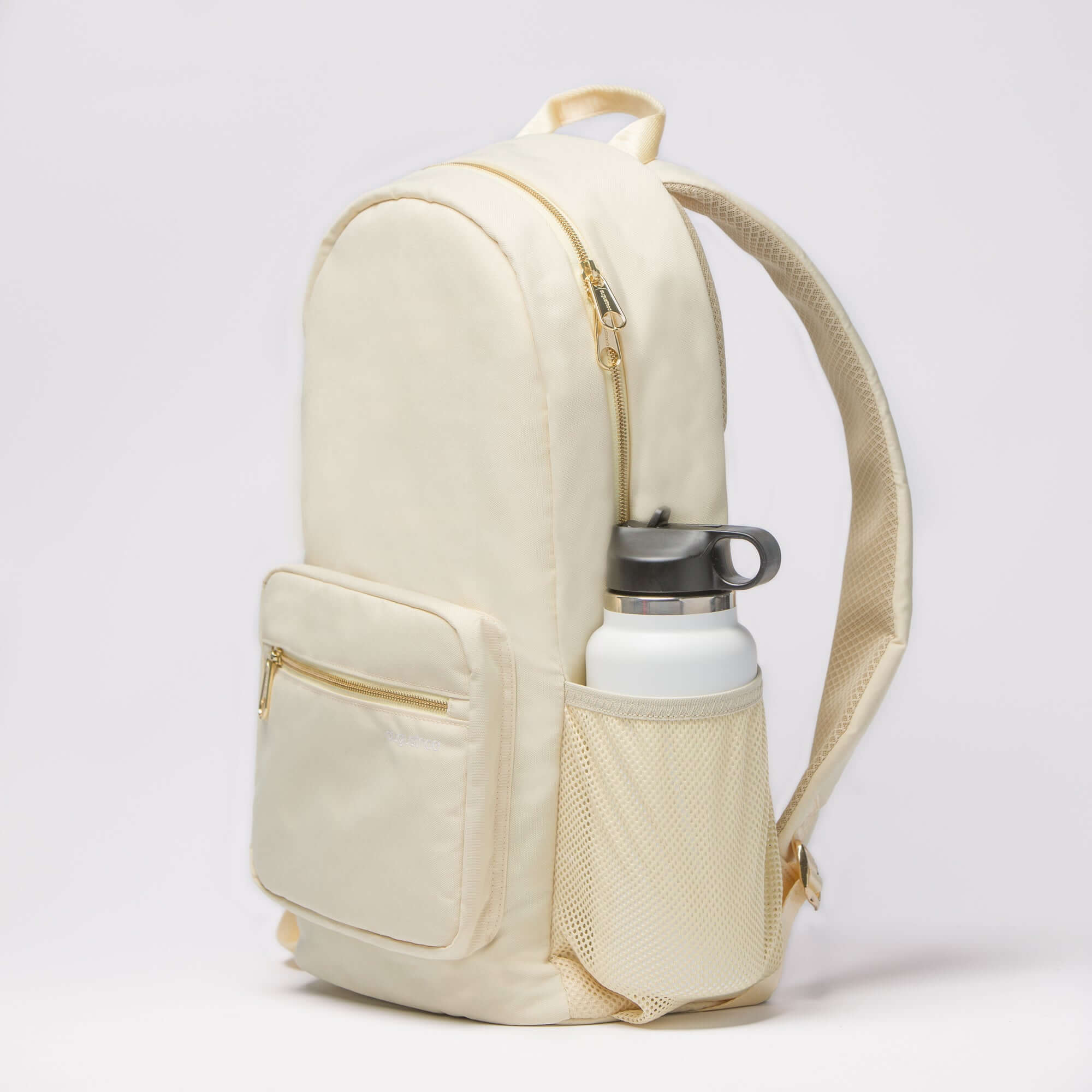 August Noa travel backpack. Side view of mesh pocket with a water bottle.