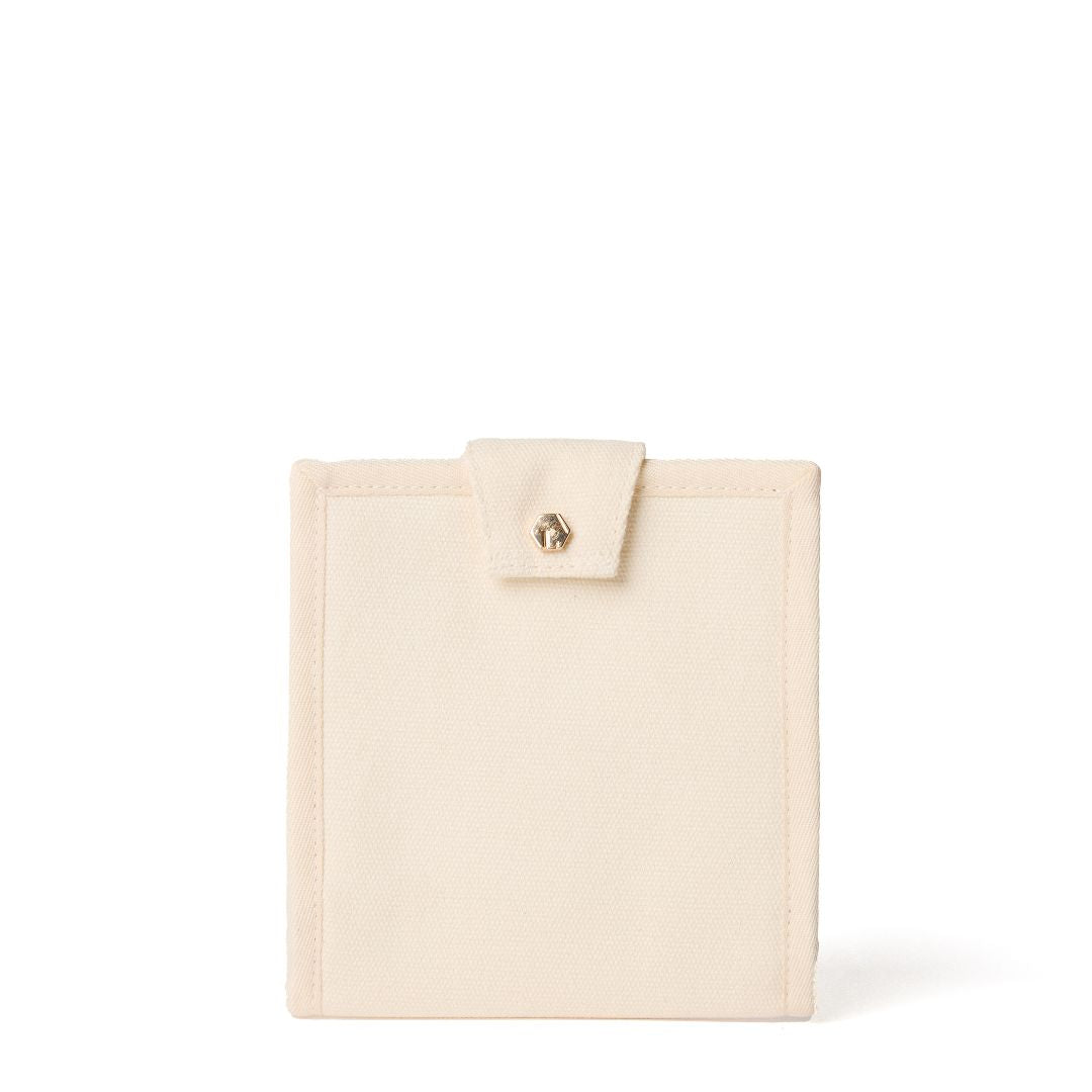 the journey travel jewelry pouch in natural canvas. Closed.