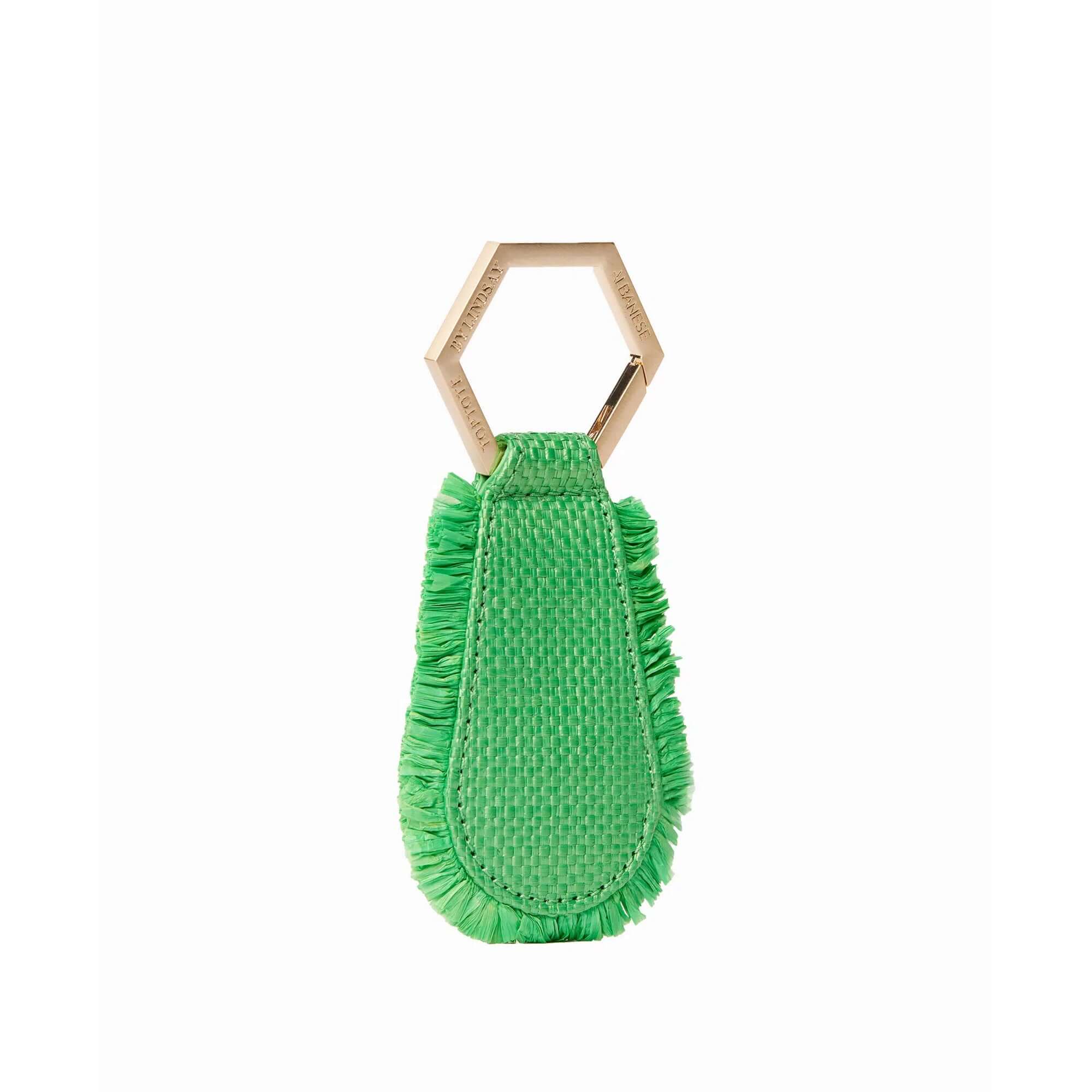 The fray TOPTOTE magnetic hat clip in green attaches to your bag and allows you to travel with your hat hands free.