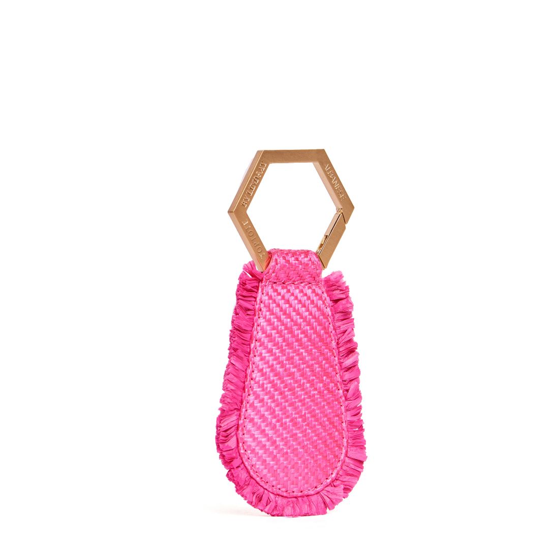 The Fray TOPTOTE Hat Clip with pink raffia trim and gold hexagonal clip for holding various types of hats.