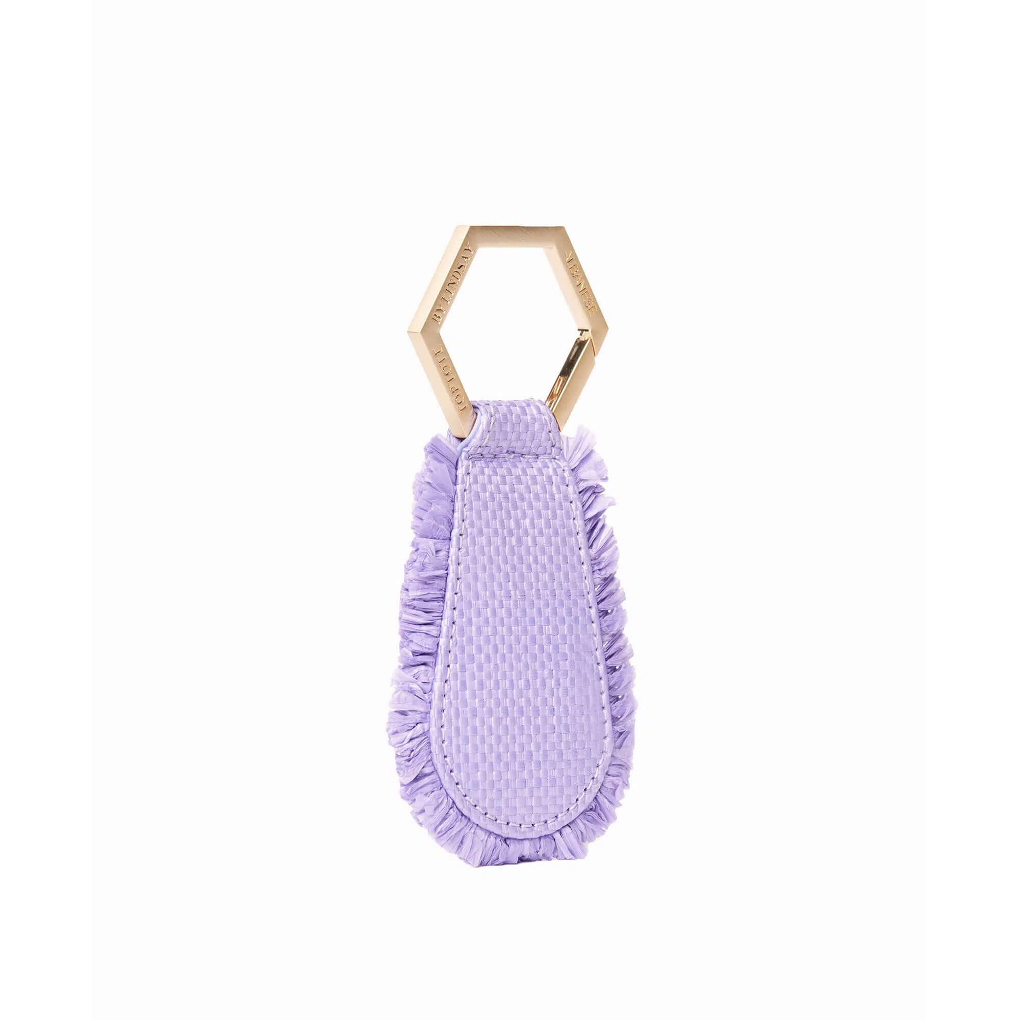 The fray TOPTOTE magnetic hat clip in lilac raffia attaches to your bag and allows you to travel with your hat hands free.