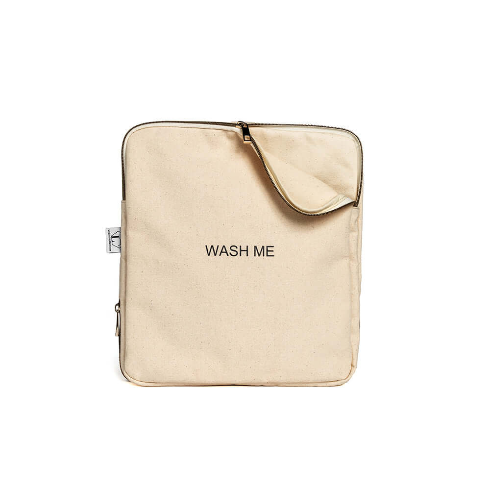 Two-sided travel laundry bag with "Wash Me" text, zipper, and divider for separating clean and dirty clothes on extended trips.