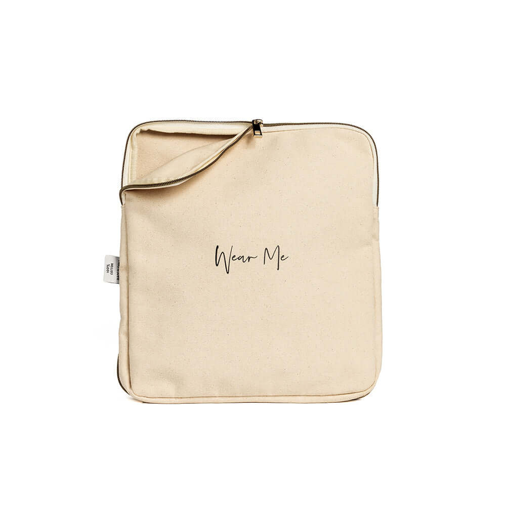 Two-sided travel laundry bag with "Wear Me" text, beige fabric, zipper opening for clean and dirty clothes separation, ideal for extended stays.