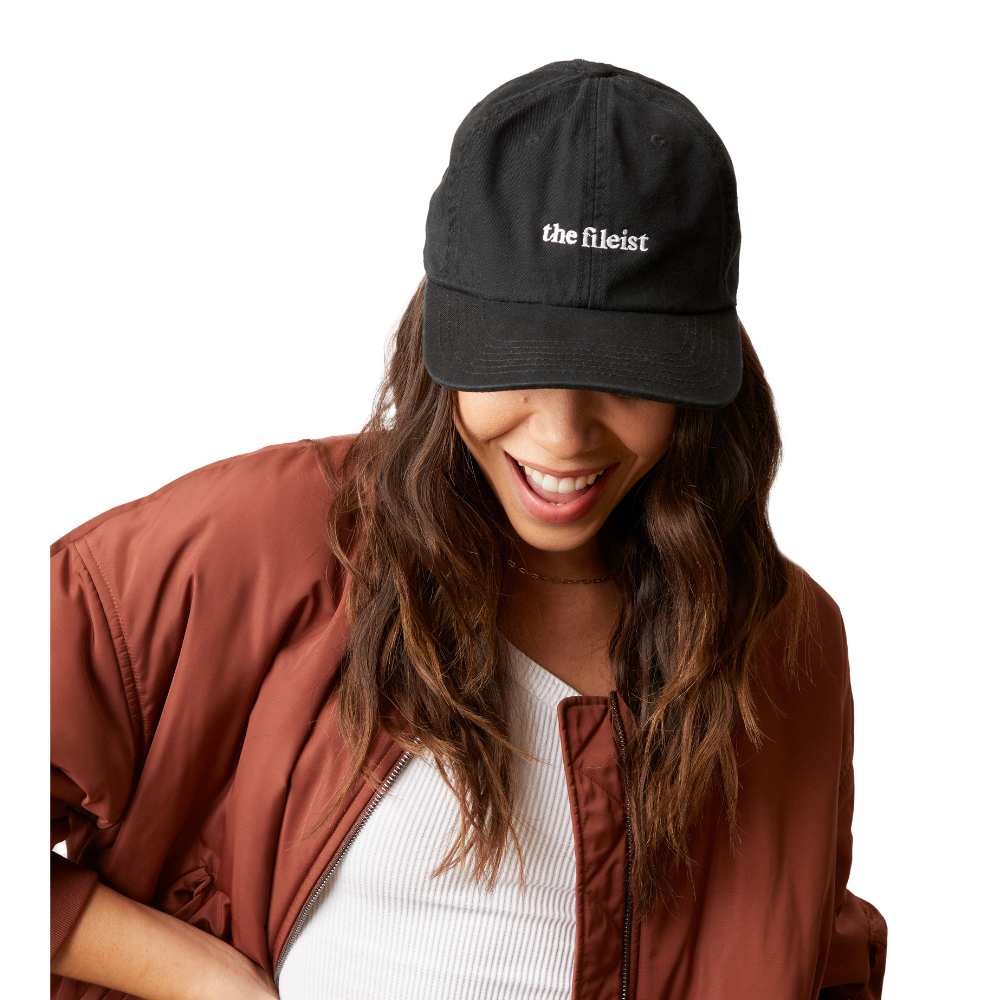 Woman wearing the fileist ball cap supporting women-owned small businesses with classic Dad hat style and adjustable back.