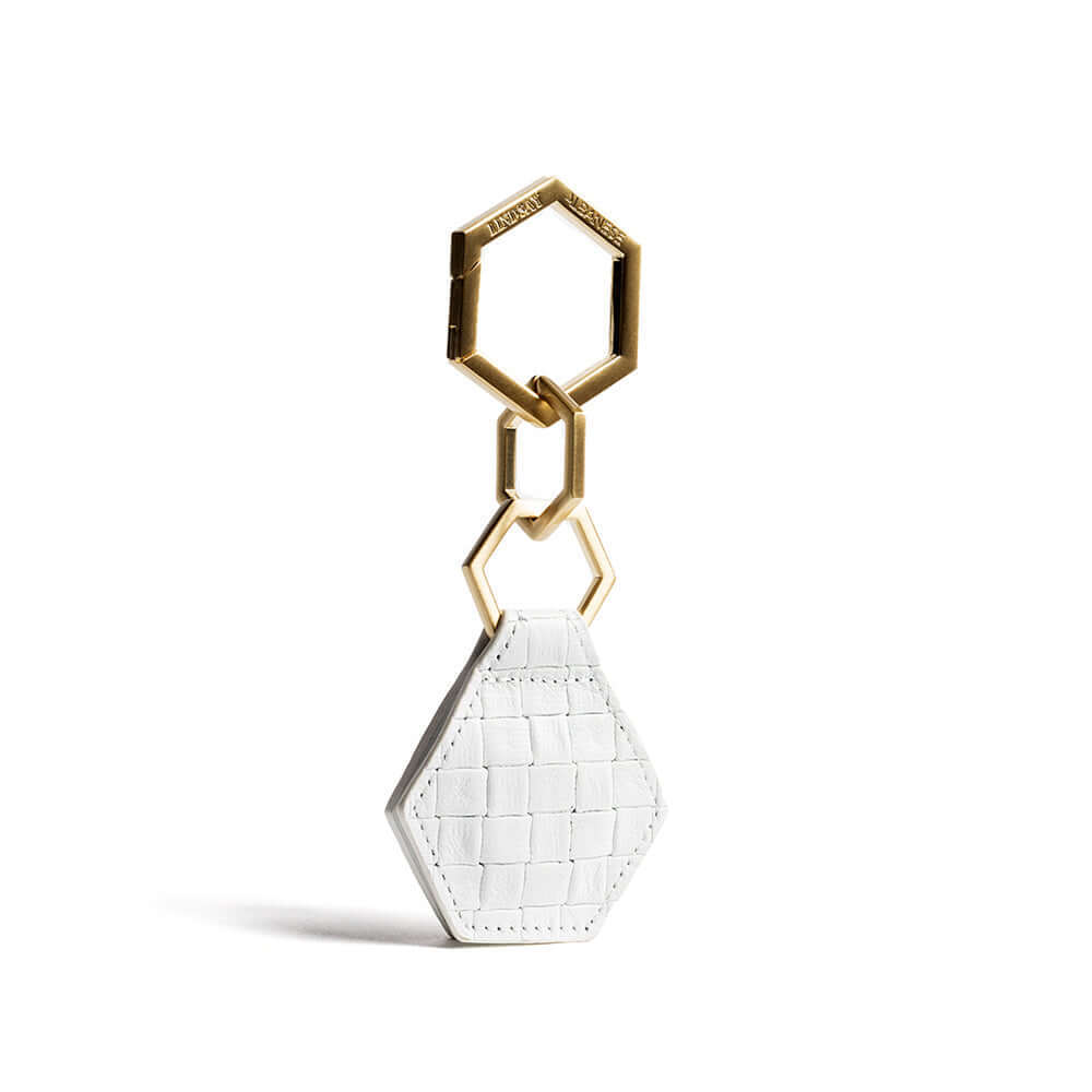 Hex TOPTOTE hat clip in white with gold hardware, showing minor paint blemish inside. Ideal for thin-brimmed hats. Final sale.
