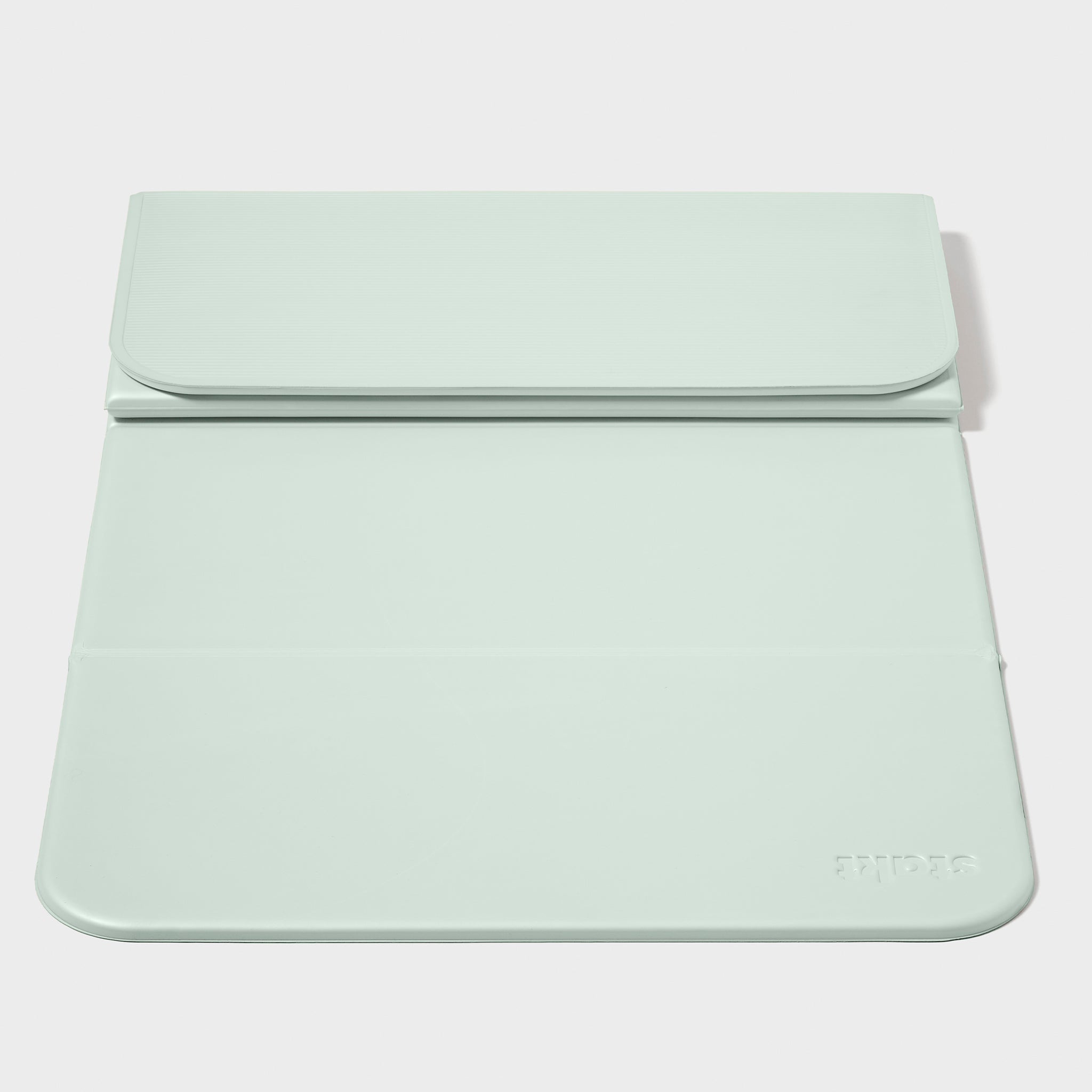 Seafoam STAKT yoga mat partially folded