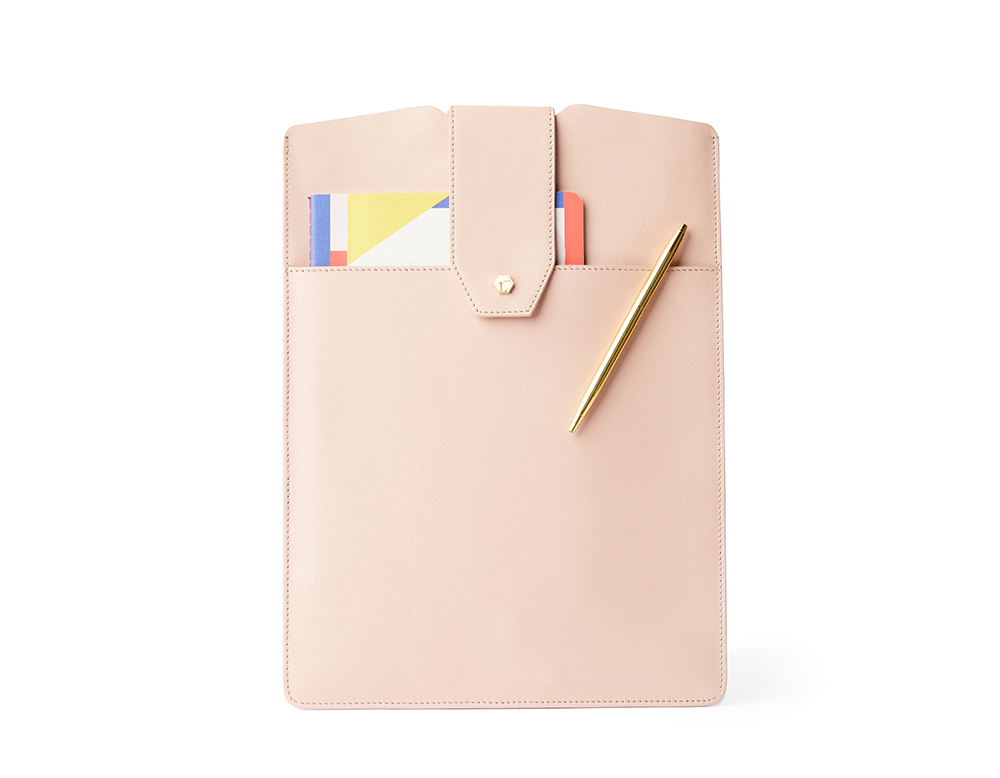 The Daily Laptop Clutch made from 100% genuine leather with front pocket holding a notepad, iPhone, and pen. Sleek and slim laptop sleeve.