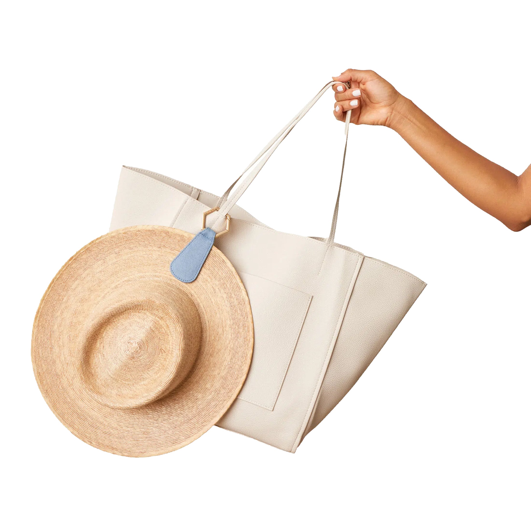 The Drop Denim TOPTOTE Hat Clip attached to a bag