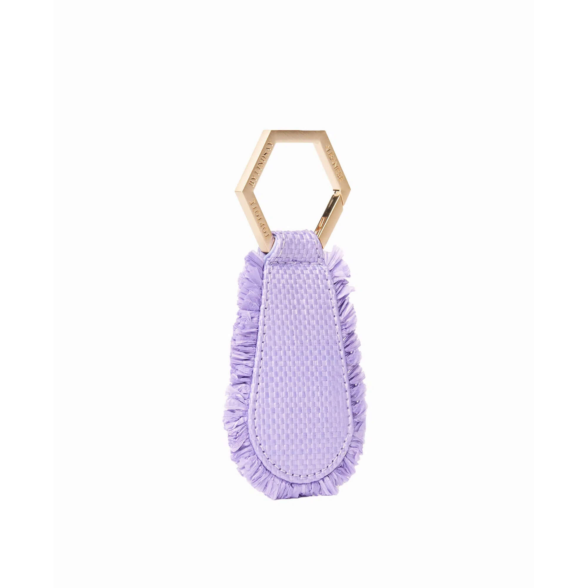  The fray TOPTOTE magnetic hat clip in lilac raffia attaches to your bag and allows you to travel with your hat hands free.