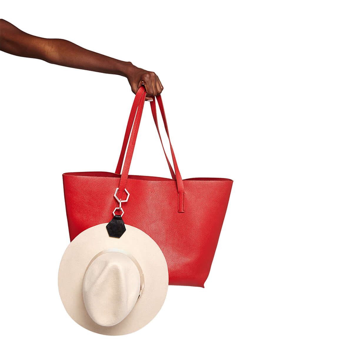 Hex TOPTOTE by Lindsay Albanese magnetic hat clip with gold hardware and genuine leather attached to white fedora hat