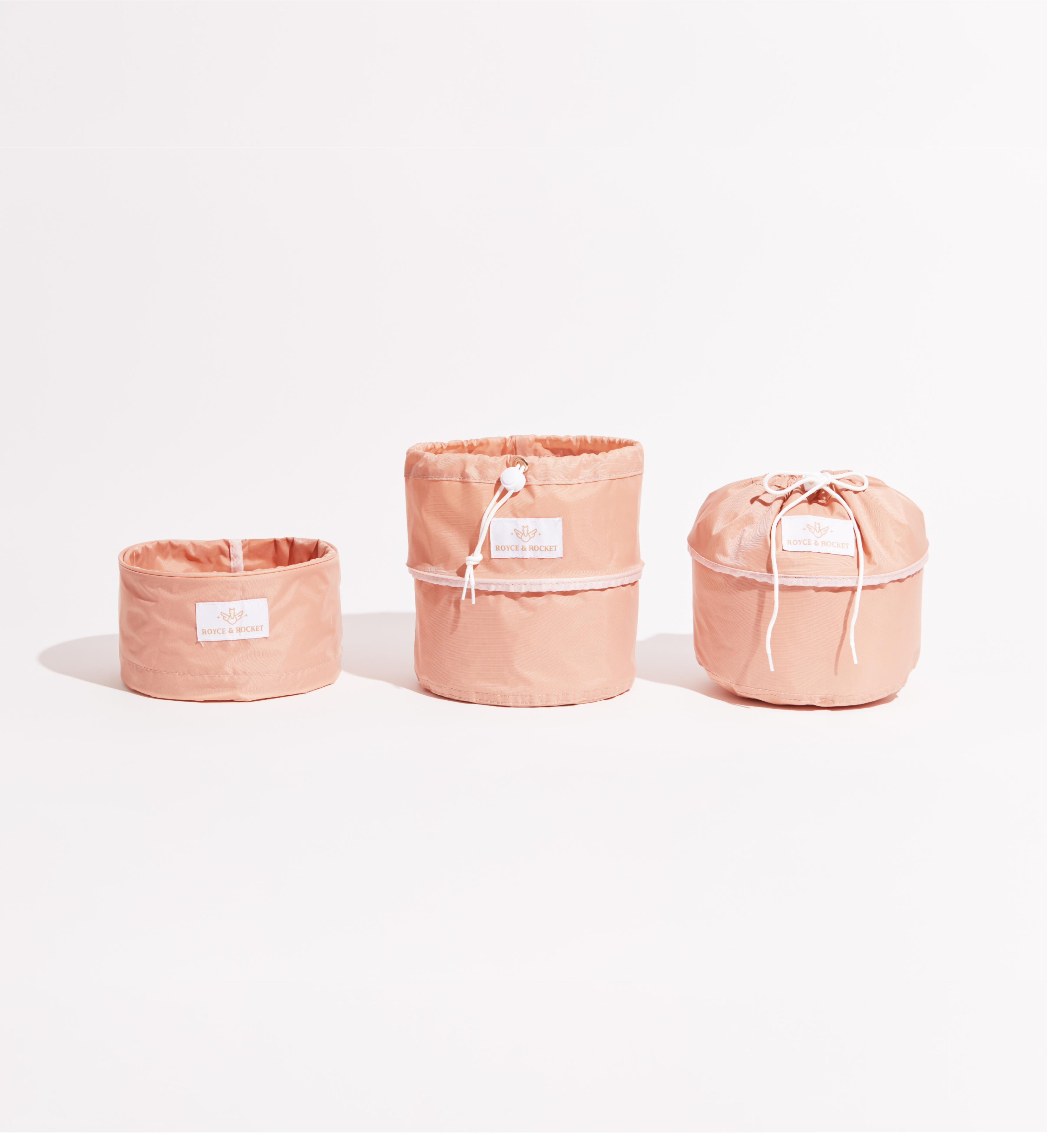 3 Cloud Pink travel organizers opened 3 different ways. 