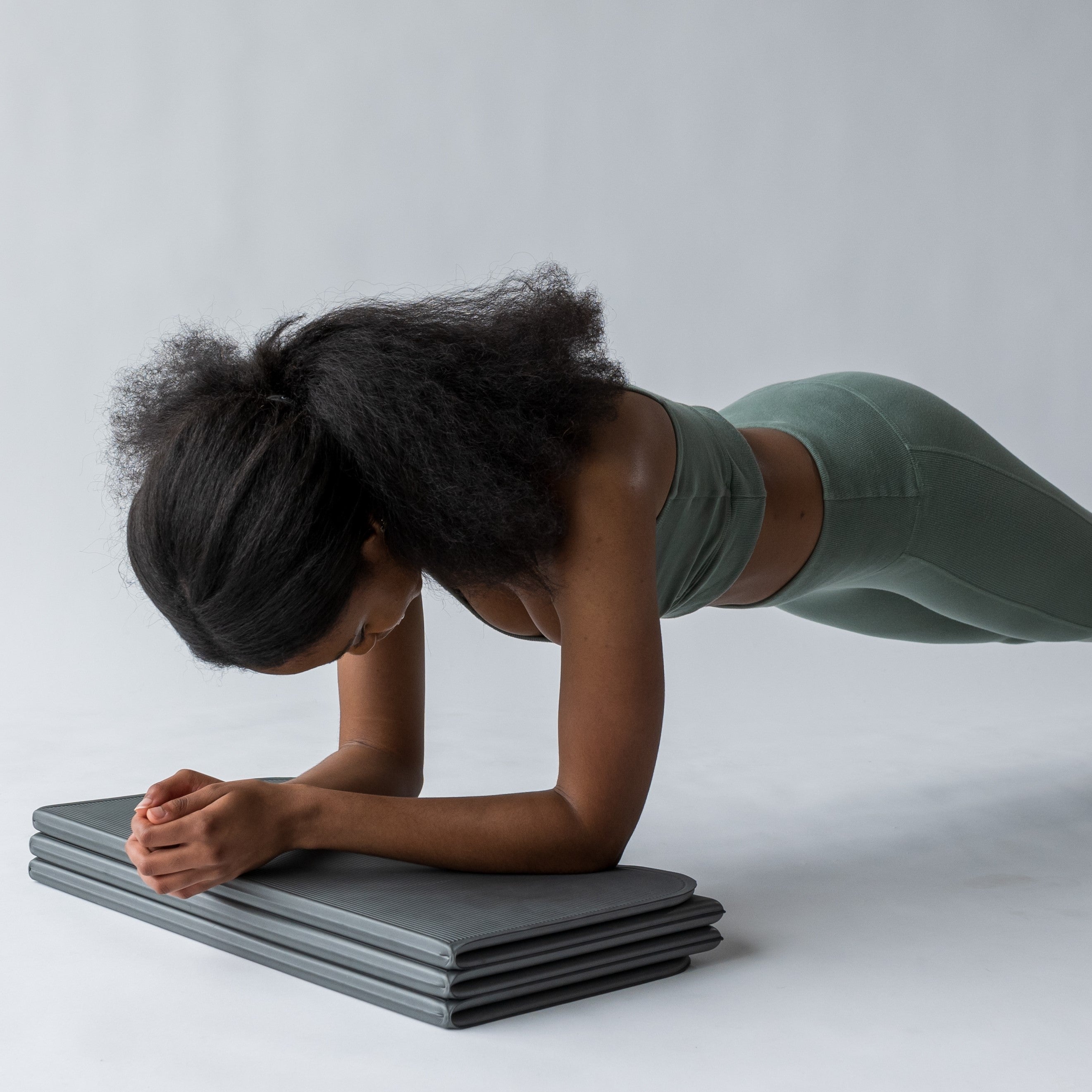 STAKT foldable yoga mat using as a block to in plank position